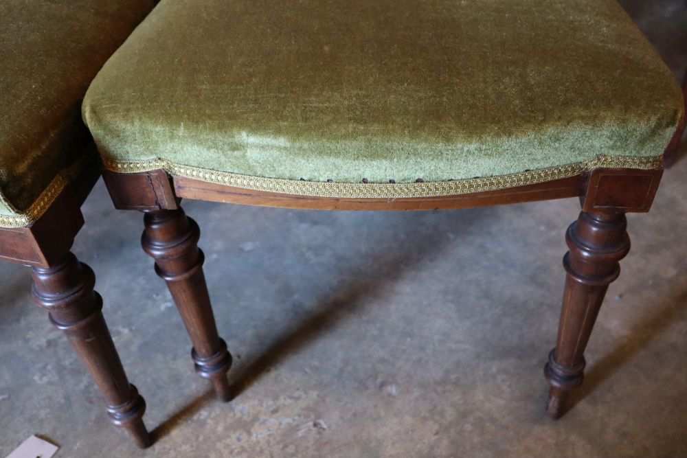 A set of four Victorian inlaid walnut dining chairs